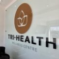 Tri-Health Wellness Centre logo sign in clinic